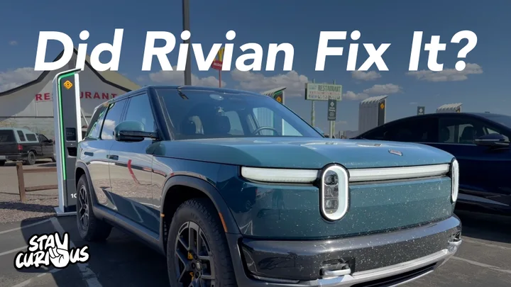Blue Rivian R2 at a charging station with the words Did Rivian Fix It?